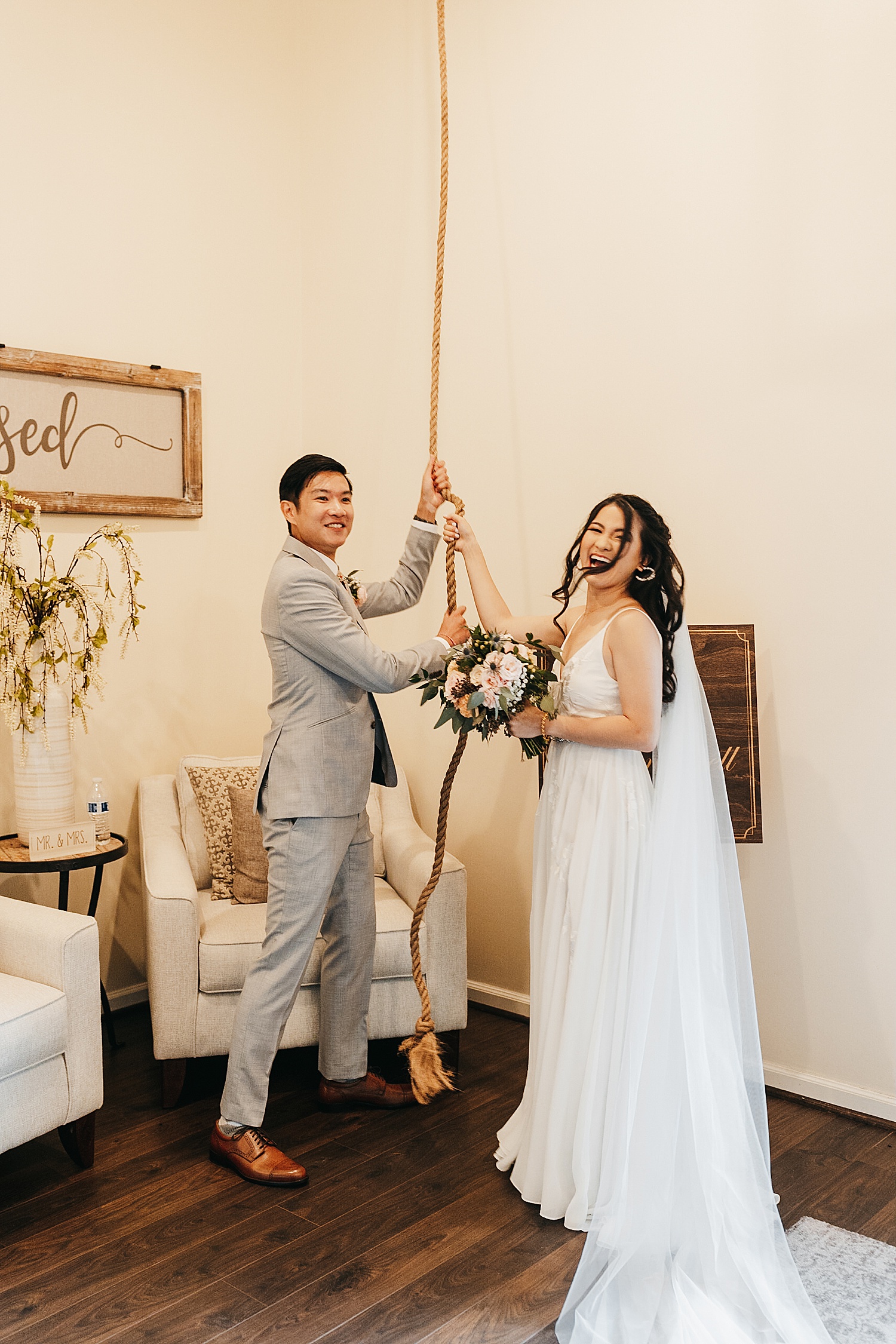 Newly married couple ring church bell at The Vine with Houston Wedding Photographer.