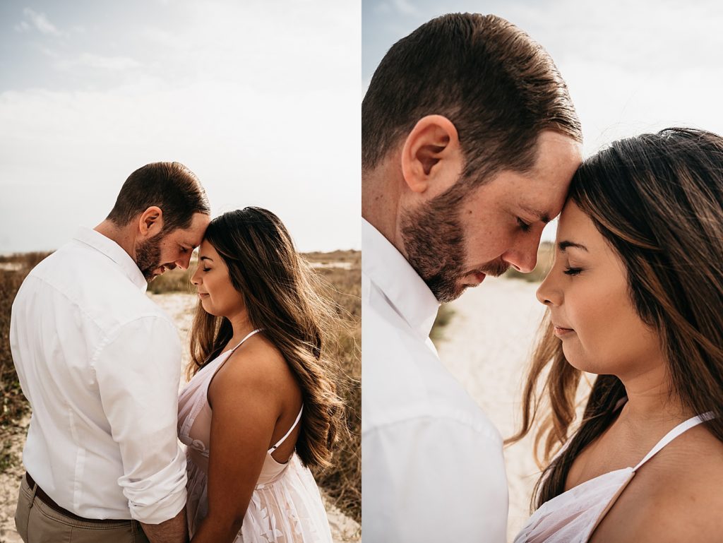 Man and woman putting their foreheads together for their engagement photo shoot.