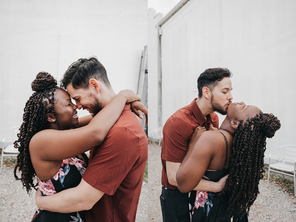 Man and woman kissing outside for their coffee date photo session. 