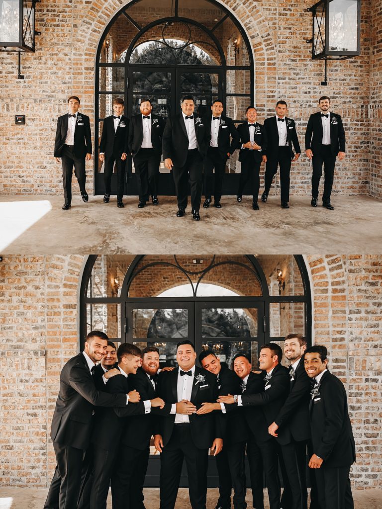 Groomsmen hugging a groom in front of a brick wall by Houston Wedding photographer, Brittany Emanuel. 